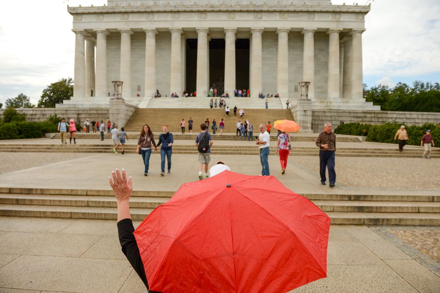 Dianna Moore of Musketen, Mich. makes her way up the steps to the Lincoln Memorial on the first day monuments reopen on the National Mall after the government shutdown, Washington, D.C., Thursday, October 17, 2013. Moore and her husband have been staying in town for a week, waiting for the government shutdown to end. (Andrew Harnik/The Washington Times)