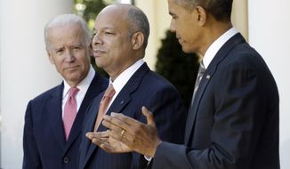 President Barack Obama, right, stands with Jeh Johnson, center, his choice for the next Homeland Security Secretary, and Vice President Joe Biden, left, in the Rose Garden at the White House in Washington, Friday, Oct. 18, 2013. Johnson was general counsel at the Defense Department during the wars in Iraq and Afghanistan.(AP Photo/Pablo Martinez Monsivais)