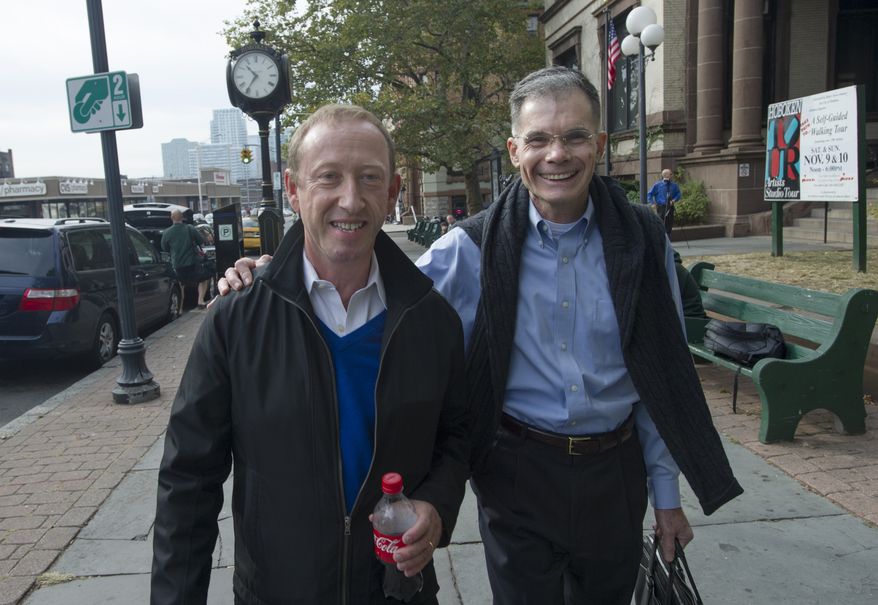 Paul Somerville (left) and Allen Kratz of Hoboken, N.J., leave Hoboken City Hall after applying for a marriage license on Saturday, Oct. 19, 2013. (AP Photo/Joe Epstein)