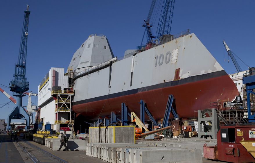 In this photo made Tuesday, Oct. 8, 2013, the first-in-class Zumwalt, the largest U.S. Navy destroyer ever built, is seen at Bath Iron Works in Bath, Maine. The christening of the Zumwalt was canceled once because of the government shutdown. But plans call for the ship to be moved to dry dock in Maine and floated without fanfare in the coming days. (AP Photo/Robert F. Bukaty)