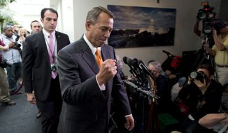 ** FILE ** In this Oct. 16, 2013, file photo Speaker of the House Rep. John Boehner, R-Ohio, pumps his fist as he leaves a meeting with House Republicans on Capitol Hill in Washington during the third week of the partial federal government shutdown. (AP Photo/ Evan Vucci, File)