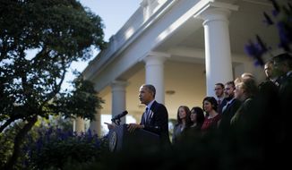 President Obama, standing with supporters of his health care law, speaks in the Rose Garden of the White House in Washington on Monday, Oct. 21, 2013, about the initial rollout of the health care overhaul. Mr. Obama acknowledged that the widespread problems with the health care law&#39;s implementation are unacceptable as the administration scrambles to fix the cascade of computer issues. (AP Photo/Charles Dharapak)