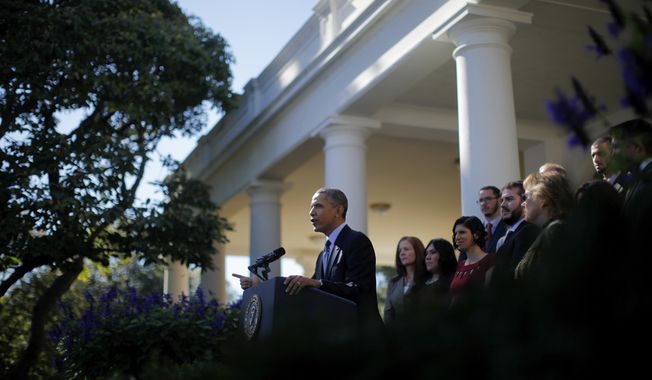 President Obama, standing with supporters of his health care law, speaks in the Rose Garden of the White House in Washington on Monday, Oct. 21, 2013, about the initial rollout of the health care overhaul. Mr. Obama acknowledged that the widespread problems with the health care law&#x27;s implementation are unacceptable as the administration scrambles to fix the cascade of computer issues. (AP Photo/Charles Dharapak)