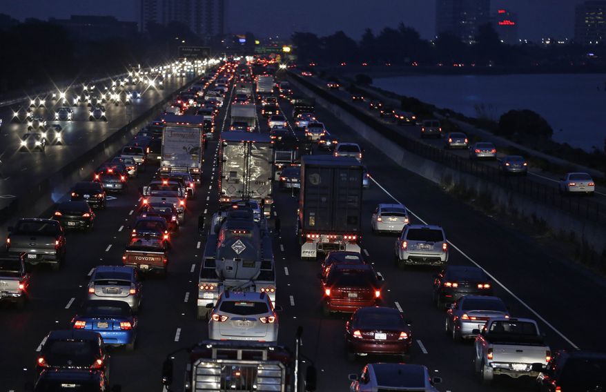 With the BART transit system on strike, traffic slows on Interstate 80 leading to the San Francisco-Oakland Bay Bridge during the morning commute Monday, Oct. 21, 2013, in Berkeley, Calif. San Francisco Bay Area commuters started the new work week on Monday with gridlocked roadways and long lines for buses and ferries as a major transit strike entered its fourth day. At the same time, federal investigators were searching for clues to a weekend train crash that killed two workers. (AP Photo/Eric Risberg)