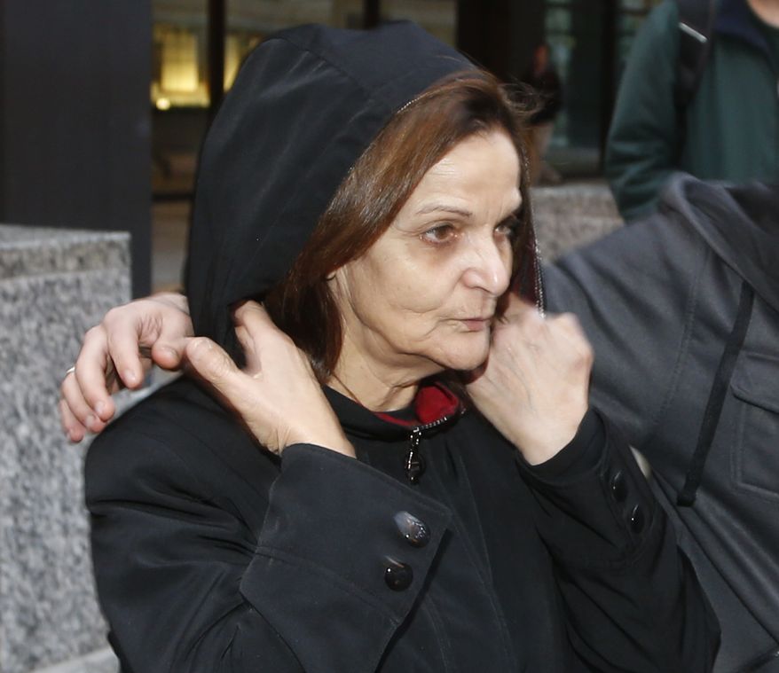 Rasmieh Yousef Odeh leaves the federal courthouse in Chicago after her initial appearance before U.S. Magistrate Judge Michael Mason on Tuesday, Oct. 22, 2013. Ms. Odeh, 66, who was arrested Tuesday, has been ordered to appear before a federal judge in Detroit on Nov. 1 on charges she allegedly lied about her conviction in a deadly bombing more than 40 years ago in Israel. (AP Photo/Charles Rex Arbogast)