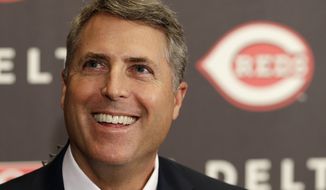Bryan Price smiles after being named manager of the Cincinnati Reds, Tuesday, Oct. 22, 2013, at a news conference in Cincinnati. Price, who had been the National League baseball team&#39;s pitching coach, was signed to a three year contract. Price replaced Dusty Baker. (AP Photo/Al Behrman)