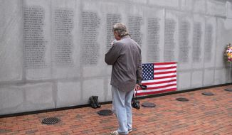 Ed Ayers, a former Marine, of Scranton, Pa., pauses at the Beirut Bombing Memorial in Jacksonville, N.C., on Wednesday, Oct. 23, 2013, the 30th anniversary of a terrorist bombing that killed 241 U.S. service members. Mr. Ayers, who did two tours in Lebanon, said the peacekeeping mission there was worth it, but &quot;I wish it was handled differently.&quot; (AP Photo/Allen G. Breed)