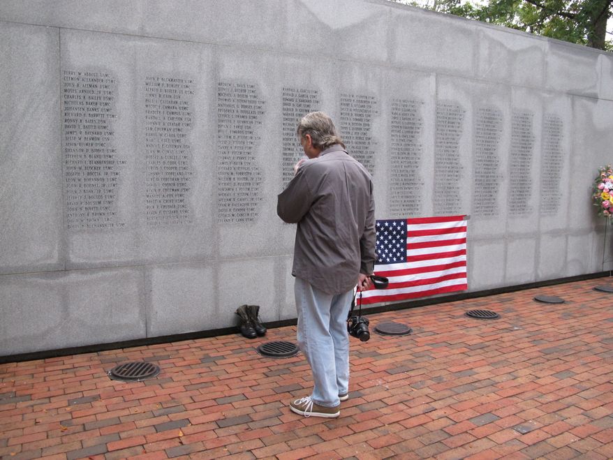 Ed Ayers, a former Marine, of Scranton, Pa., pauses at the Beirut Bombing Memorial in Jacksonville, N.C., on Wednesday, Oct. 23, 2013, the 30th anniversary of a terrorist bombing that killed 241 U.S. service members. Mr. Ayers, who did two tours in Lebanon, said the peacekeeping mission there was worth it, but "I wish it was handled differently." (AP Photo/Allen G. Breed)
