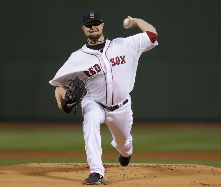 Boston Red Sox starting pitcher Jon Lester throws during the first inning of Game 1 of baseball's World Series against the St. Louis Cardinals Wednesday, Oct. 23, 2013, in Boston. (AP Photo/Charles Krupa)