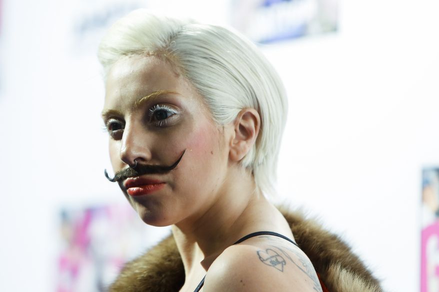 Lady Gaga arrives for a presentation of her upcoming new album "Artpop" at a fan event at the Berghain club in Berlin, Thursday, Oct. 24, 2013. (AP Photo/Markus Schreiber)