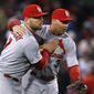 St. Louis Cardinals&#x27; Matt Holliday, left, and Carlos Beltran celebrate after Game 2 of baseball&#x27;s World Series against the Boston Red Sox Thursday, Oct. 24, 2013, in Boston. The Cardinals won 4-2 to tie the series at 1-1. (AP Photo/Elise Amendola) 