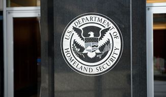 The U.S. Department of Homeland Security seal is shown here in an undated file photo. (Associated Press) ** FILE ** 
