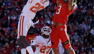 Clemson safety Jayron Kearse (20) intercepts a pass attempt to Maryland wide receiver Nigel King in the end zone in the first half of an NCAA college football game in College Park, Md., Saturday, Oct. 26, 2013. (AP Photo/Patrick Semansky)