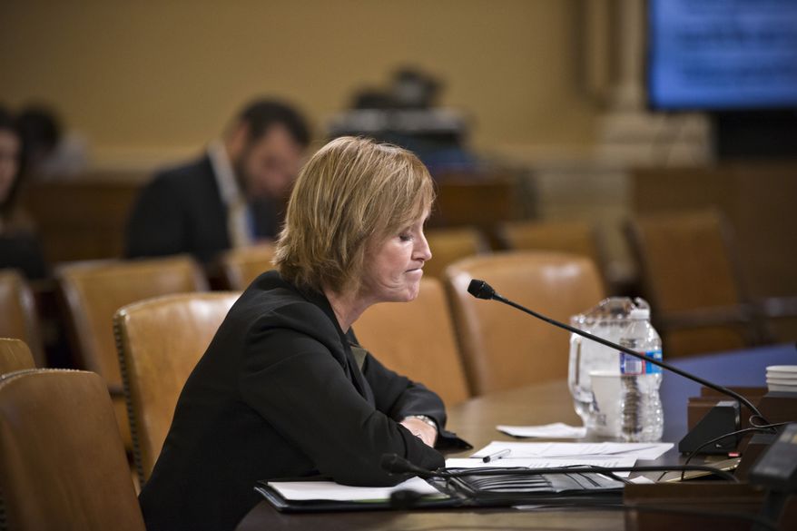 Marilyn Tavenner, the administrator of the Centers for Medicare and Medicaid Services, pauses while testifying on Capitol Hill in Washington, Tuesday, Oct. 29, 2013, before the House Ways and Means Committee hearing on the implementation of the Affordable Care Act. Stressing that improvements are happening daily, the senior Obama official closest to the administration's malfunctioning health care website apologized Tuesday for problems that have kept Americans from successfully signing up for coverage. (AP Photo/J. Scott Applewhite)