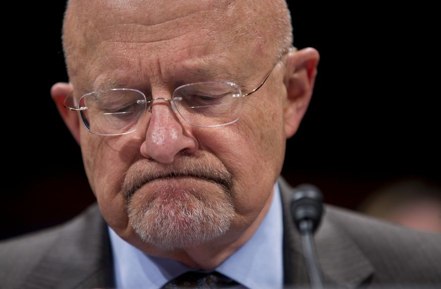 Director of National Intelligence James Clapper pauses while testifying on Capitol Hill in Washington, Tuesday, Oct. 29, 2013, before the House Intelligence Committee hearing on potential changes to the Foreign Intelligence Surveillance Act (FISA). Faced with anger over revelations about U.S. spying at home and abroad, members of Congress suggested Tuesday that programs the Obama administration says are needed to combat terrorism may have gone too far. (AP Photo/ Evan Vucci)