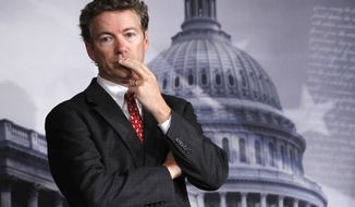Sen. Rand Paul, Kentucky Republican, listens to a question during a news conference on Capitol Hill in Washington on Oct. 13, 2011. (AP Photo/Manuel Balce Ceneta)