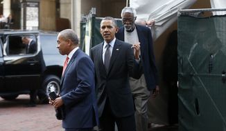 President Barack Obama emerges from a tent with Massachusetts Gov. Deval Patrick, left, and former Boston Celtics center Bill Russell, after he got a private viewing of a statue honoring Russell in Boston, Wednesday, Oct. 30, 2013. (AP Photo/Charles Dharapak)