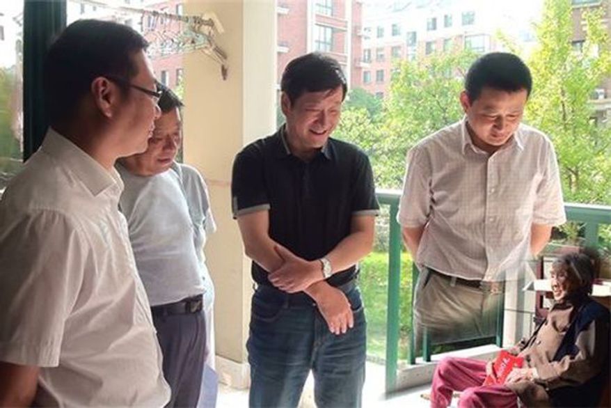 In a photo originally posted to a county government website, local officials purportedly visit a 100-year-old woman in Anhui province.
Credit Ningguo Civil Affairs Department via Chinanews.com