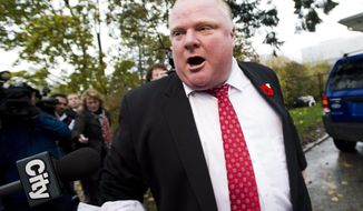 Toronto Mayor Rob Ford tells the media to get off his property as he leaves his home in Toronto on Thursday, Oct. 31, 2013. (AP Photo/Nathan Denette)