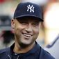FILE - In this July 22, 2013, file photo, New York Yankees shortstop Derek Jeter laughs while standing in the dugout with teammates during a baseball game against the Texas Rangers in Arlington, Texas. Jeter and the Yankees have agreed to a $12 million, one-year contract on Friday, Nov. 1, 2013.  (AP Photo/LM Otero, File)