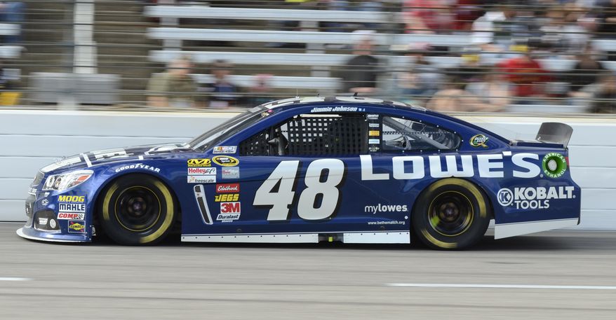 Jimmie Johnson (48) takes turn four during the NASCAR Sprint Cup series auto race at Texas Motor Speedway in Fort Worth, Texas, Sunday, Nov. 3, 2013. (AP Photo/Larry Papke)
