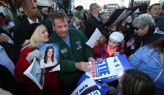 New Jersey Gov. Chris Christie signs autographs after making a campaign stop at the Sussex County GOP Headquarters in Newton Sunday, Nov. 3, 2013.  (AP Photo/New Jersey Herald, Daniel Freel)