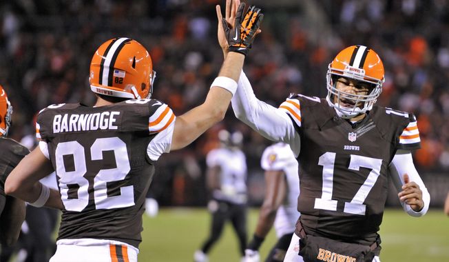 Cleveland Browns quarterback Jason Campbell (17) celebrated with tight end Gary Barnidge (82) after they hooked up on a 4-yard touchdown pass against the Baltimore Ravens in the third quarter of an NFL football game Sunday, Nov. 3, 2013. (AP Photo/David Richard)