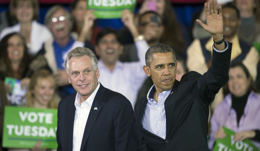 President Obama appears at a campaign rally with supporters for Virginia Democratic gubernatorial candidate Terry McAuliffe (left) at Washington-Lee High School in Arlington, Va., on Sunday, Nov. 3, 2013. (AP Photo/Cliff Owen)