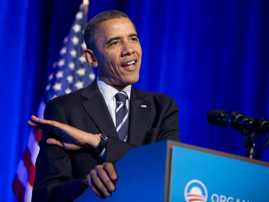 President Barack Obama gestures to describe the height of his daughters as he speaks at an Organizing for Action event in Washington, Monday, Nov. 4, 2013. (AP Photo/Manuel Balce Ceneta)
