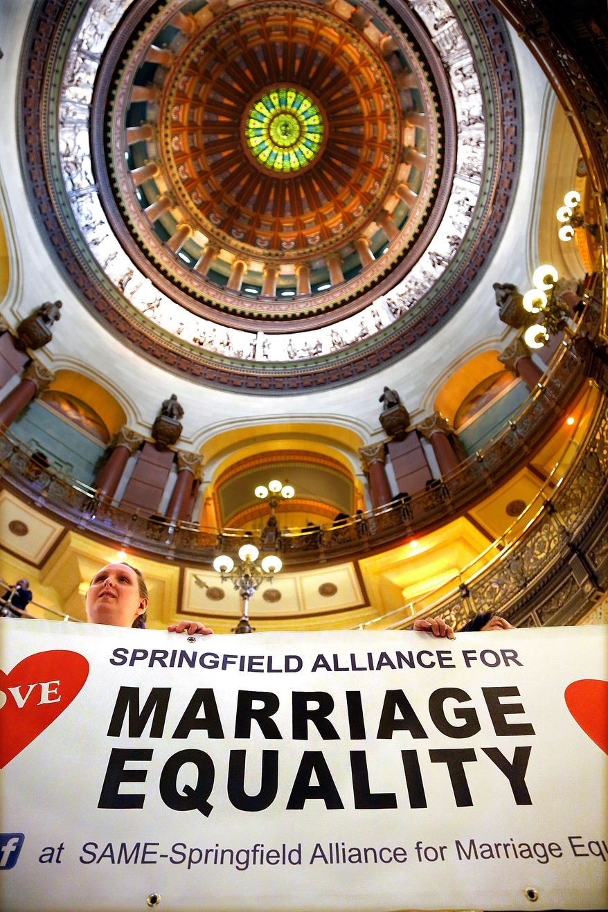 Supporters of same sex marriage legislation rally in the rotunda at the Illinois State Capitol during veto session Tuesday, Nov. 5, 2013 in Springfield Ill. Illinois lawmakers are expecting to consider gay marriage legislation during this week's veto session. (AP Photo/Seth Perlman)
