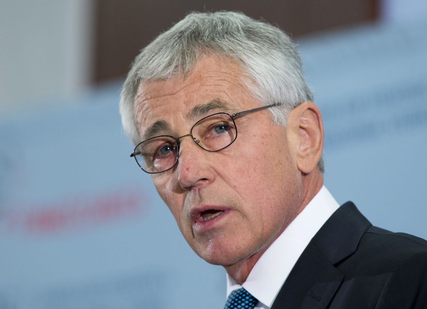 Defense Secretary Chuck Hagel speaks at the Center for Strategic and International Studies (CSIS), in Washington, Tuesday, Nov. 5, 2013. Hagel said the projected defense budget cuts of nearly $1 trillion over 10 years is too much, too fast, and will cause a dangerous erosion of U.S. military power. In a speech about U.S. defense priorities, Hagel said Tuesday that it would be a mistake to let these cuts happen. But he also said officials are not assuming the government's budget crisis will be resolved soon. (AP Photo/Manuel Balce Ceneta)