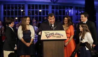 Republican New Jersey Gov. Chris Christie reacts to shouts from the crowd as he stands with his wife Mary Pat Christie, center right, and their children, Andrew, back right, Bridget, front right, Patrick, left, and Sarah, second left,  as they celebrate his election victory in Asbury Park, N.J., Tuesday, Nov. 5, 2013, after defeating Democratic challenger Barbara Buono . (AP Photo/Mel Evans)