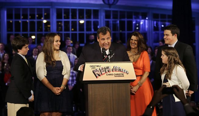 Republican New Jersey Gov. Chris Christie reacts to shouts from the crowd as he stands with his wife Mary Pat Christie, center right, and their children, Andrew, back right, Bridget, front right, Patrick, left, and Sarah, second left,  as they celebrate his election victory in Asbury Park, N.J., Tuesday, Nov. 5, 2013, after defeating Democratic challenger Barbara Buono . (AP Photo/Mel Evans)