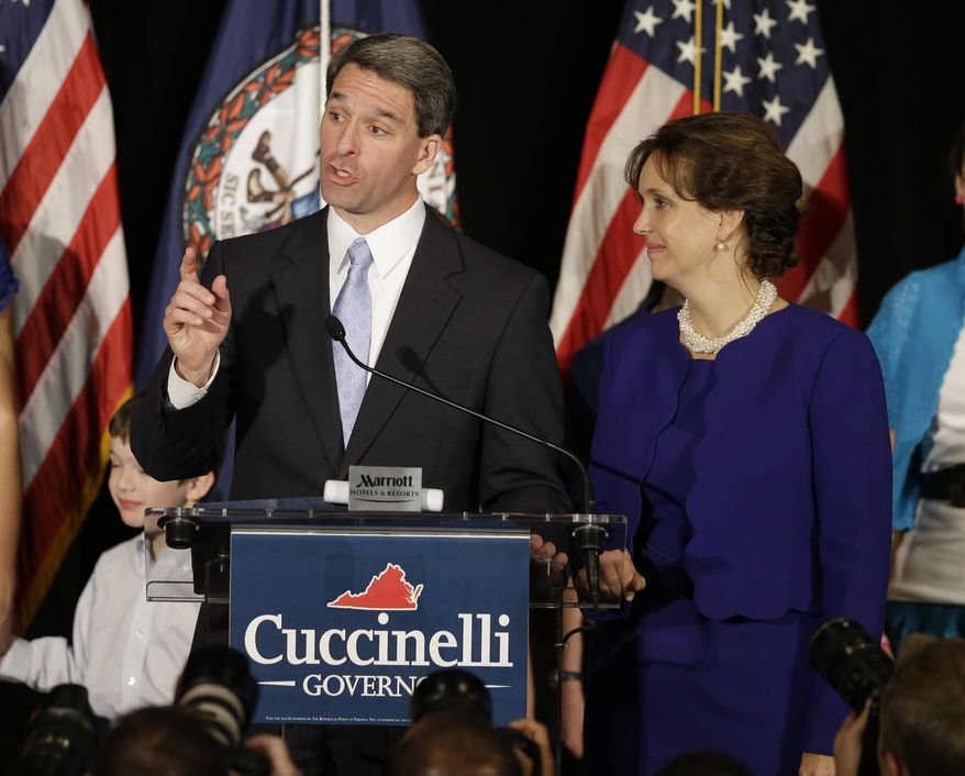 Virginia Attorney General Kenneth T. Cuccinelli II, the Republican gubernatorial candidate, delivers his concession speech with his wife, Teiro, during an election-night party in Richmond on Tuesday, Nov. 5, 2013. Mr. Cuccinelli lost to Democrat Terry McAuliffe. (AP Photo/Steve Helber)