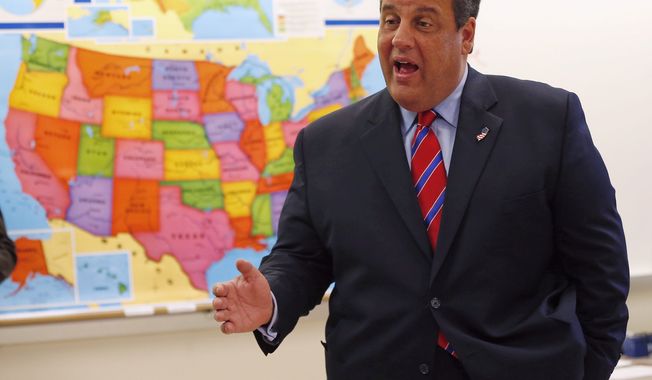 New Jersey Gov. Chris Christie visits a school a day after his landslide win. Tea partyers say the Republican National Committee spent money on his campaign that should have gone to Kenneth T. Cuccinelli II in Virginia. (Associated Press)
