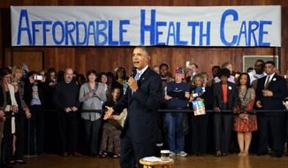**FILE** President Barack Obama speaks at Temple Emanu-El on Nov. 6, 2013, in Dallas, as he promotes his health care law. (Associated Press/The Dallas Morning News, Louis DeLuca)