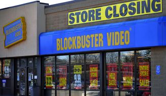 ** FILE ** This March 17, 2010, file photo, shows a closing Blockbuster stores in Racine, Wis. Dish Network announced Wednesday, Nov. 6, 2013, it will close the remaining 300 Blockbuster locations scattered across the United States. Dish Network expects the stores to be closed by early January. Dish Network says about 2,800 people will lose their jobs. (AP Photo/Journal Times, Scott Anderson, File)