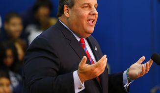 New Jersey Gov. Chris Christie talks to the media as he visits Jose Marti Freshman Academy in Union City, N.J., on Wednesday, Nov. 6, 2013, the day after defeating state Sen. Barbara Buono, his Democratic challenger, to win his second term as governor. (AP Photo/Rich Schultz)