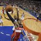 Washington Wizards&#39; Bradley Beal (3) goes up for a dunk as Philadelphia 76ers&#39; Thaddeus Young trails during the first half of an NBA basketball game, Wednesday, Nov. 6, 2013, in Philadelphia. (AP Photo/Matt Slocum)