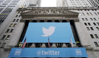 ** FILE ** Twitter signage is draped on the facade of the New York Stock Exchange, Thursday, Nov. 7, 2013 in New York. (AP Photo/Mark Lennihan)