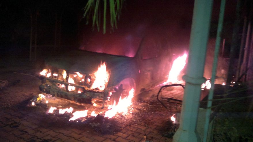 Armoured embassy SUV burning on the night of the Sept. 11, 2012 Benghazi attack at QRF villa. (Photo by Zahid Arman)