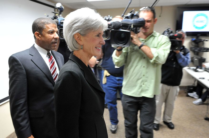 ** FILE ** Health and Human Services Secretary Kathleen Sebelius enters the navigator room with Southside Medical Center CEO Dr. David Williams on Friday, Nov. 8, 2013 in Atlanta. (AP Photo/Atlanta Journal-Constitution, Kent D. Johnson)