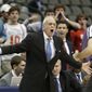 SMU head coach Larry Brown, left, yells at a referee during the first half of an NCAA college basketball game against TCU in Dallas, Friday, Nov. 8, 2013. (AP Photo/LM Otero)