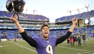 Baltimore Ravens kicker Justin Tucker celebrates his game winning field goal as he leaves the field after a NFL football game against the Cincinnati Bengals in Baltimore, Sunday, Nov. 10, 2013. The Ravens defeated Bengals 20-17 in overtime. (AP Photo/Nick Wass)