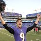 Baltimore Ravens kicker Justin Tucker celebrates his game winning field goal as he leaves the field after a NFL football game against the Cincinnati Bengals in Baltimore, Sunday, Nov. 10, 2013. The Ravens defeated Bengals 20-17 in overtime. (AP Photo/Nick Wass)