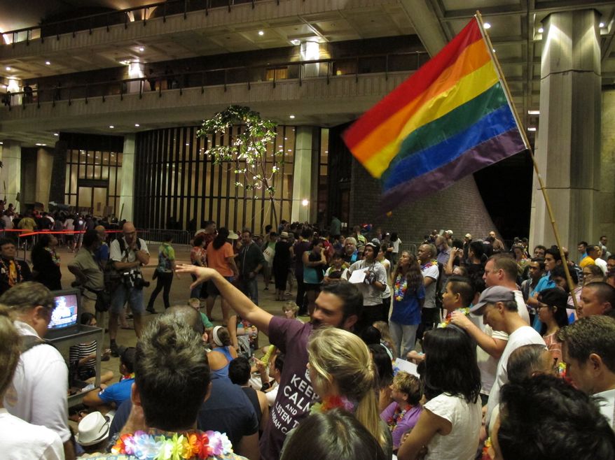 ** FILE ** Proponents of gay marriage rally outside the House chambers at the Hawaii Capitol in Honolulu on Friday, Nov. 8, 2013. (AP Photo/Oskar Garcia)