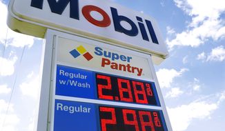 Regular gas is priced at $ 2.88 per gallon at the Mobil gas filling station Tuesday, Nov. 12, 2013, in Chatham, Ill. U.S. pump prices are the lowest they&#39;ve been since February 2011. (AP Photo/Seth Perlman)