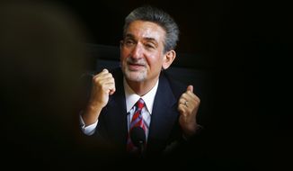 Washington Wizards basketball and Washington Capitals hockey teams owner Ted Leonsis gestures during an interview with The Associated Press in Washington, Tuesday, Nov. 12, 2013.  (AP Photo/Charles Dharapak)