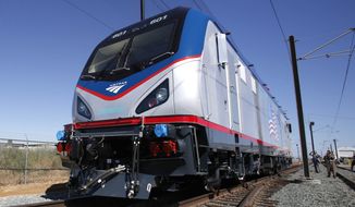 **FILE** One of the new Amtrak Cities Sprinter Locomotive makes a demonstration run during unveiling ceremonies at the Siemens Rails Systems factory in Sacramento, Calif., on May 13, 2013. (Associated Press)