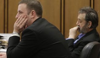 Defense attorney Joseph Patituce (left) and Bobby Thompson, whom authorities have identified as Harvard-trained lawyer John Donald Cody, listen during closing statements by the prosecution on Wednesday, Nov. 13, 2013, in Cleveland. Thompson was convicted on Thursday of defrauding the United States Navy Veterans Association, a charity he ran from Tampa, Fla. (AP Photo/Tony Dejak)

